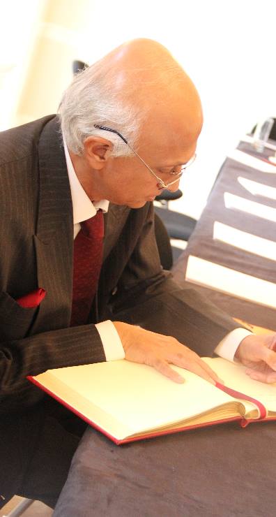 The Indian High Commissioner to the UK HE Mr Ranjan Mathai signs the Asia House guest book.