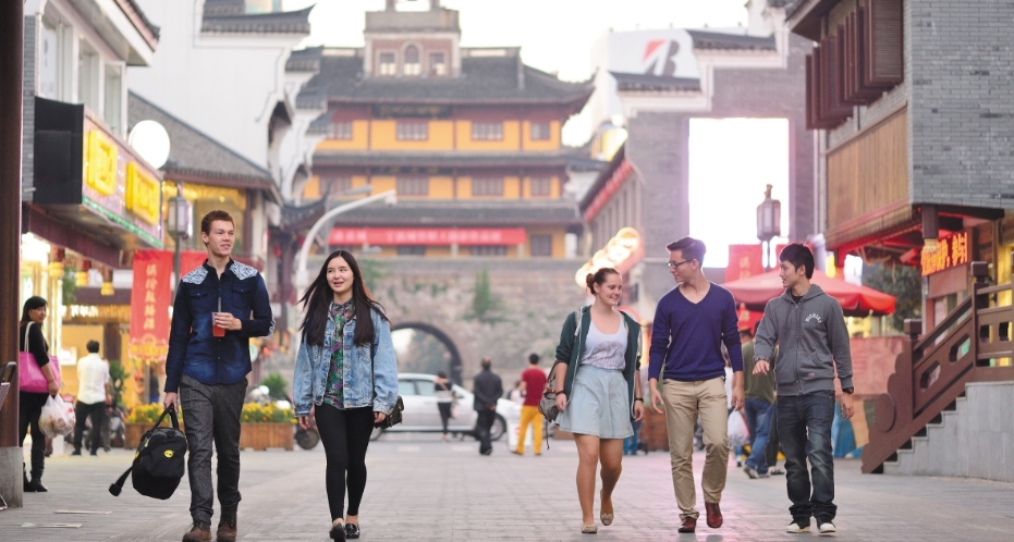 Young people walk past the Drum Tower in the city of Ningbo in the coastal province of Zhejiang, near Shanghai. Photo courtesy University of Nottingham Ningbo China