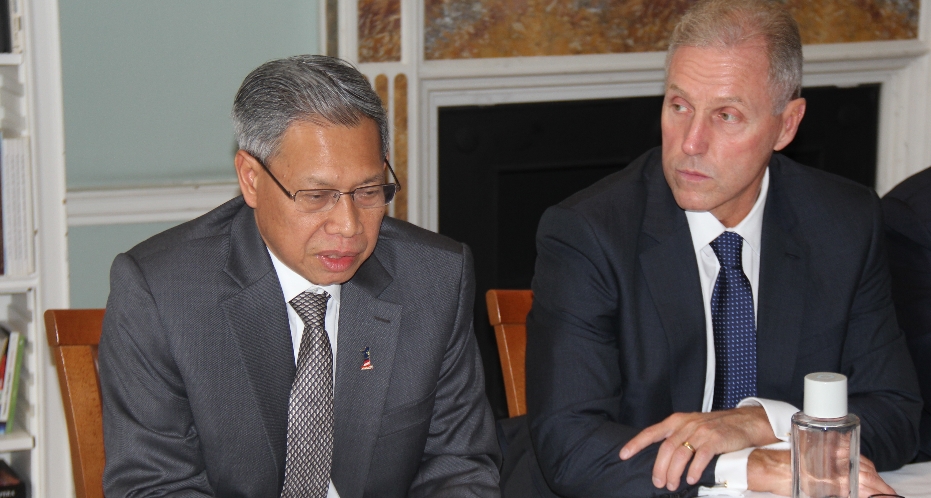 Malaysia's Minister of International Trade and Industry Mustapa Mohamed (left) addresses an audience of business leaders at Asia House. Michael Lawrence, CEO, Asia House, right.